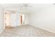 Bedroom with carpeted floors and a view into the kitchen and bathroom at 7645 Briarstone Ln, Indianapolis, IN 46227