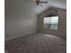 Spacious bedroom with a large window providing natural light and vaulted ceiling at 7645 Briarstone Ln, Indianapolis, IN 46227