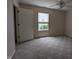 Well-lit bedroom with neutral walls and carpet, ideal for personalization and relaxation, complete with a ceiling fan at 7645 Briarstone Ln, Indianapolis, IN 46227