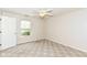 Bedroom with ceiling fan and window at 7645 Briarstone Ln, Indianapolis, IN 46227