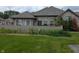 Charming brick home featuring a lush green lawn and privacy fence in a well-maintained community at 7645 Briarstone Ln, Indianapolis, IN 46227