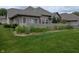 Charming brick home featuring a lush green lawn and privacy fence, blending elegance and privacy at 7645 Briarstone Ln, Indianapolis, IN 46227