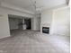 Open-concept living room provides ample space and a fireplace, perfect for comfortable living and entertaining at 7645 Briarstone Ln, Indianapolis, IN 46227