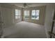 Spacious living room features natural light, neutral walls, and a ceiling fan, offering comfort and style at 7645 Briarstone Ln, Indianapolis, IN 46227