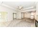 Spacious carpeted living room with a fireplace and views of the dining area and kitchen at 7645 Briarstone Ln, Indianapolis, IN 46227