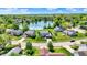 Beautiful aerial view of homes surrounding a peaceful lake in a desirable neighborhood at 7670 Lippincott Way, Indianapolis, IN 46268