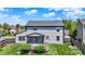 View of back of house showing large lawn, deck and screened in porch at 7670 Lippincott Way, Indianapolis, IN 46268