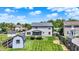 A spacious lawn with a shed and back deck, perfect for outdoor entertaining and relaxing at 7670 Lippincott Way, Indianapolis, IN 46268