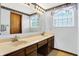 Spacious bathroom with dual sinks, generous counter space, and plenty of natural light at 7670 Lippincott Way, Indianapolis, IN 46268