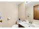 Half bathroom features a stylish vanity, mirror, and neutral decor at 7670 Lippincott Way, Indianapolis, IN 46268