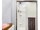 Clean bathroom shower with sliding glass doors and a modern shower head at 7670 Lippincott Way, Indianapolis, IN 46268