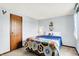 Comfortable bedroom with a cozy bed, soft carpet, and natural light offers a peaceful space for relaxation at 7670 Lippincott Way, Indianapolis, IN 46268