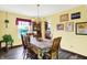 Dining room with hardwood floors and natural light at 7670 Lippincott Way, Indianapolis, IN 46268