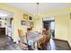 Bright dining room with hardwood floors and traditional chandelier at 7670 Lippincott Way, Indianapolis, IN 46268
