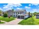 Well-maintained two-story home with attached garage and manicured lawn at 7670 Lippincott Way, Indianapolis, IN 46268