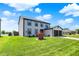 Traditional two-story home featuring an attached two-car garage, and a well manicured lawn at 7670 Lippincott Way, Indianapolis, IN 46268