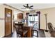 Kitchen featuring hardwood floors, an island with seating, and an adjacent eating area at 7670 Lippincott Way, Indianapolis, IN 46268