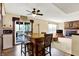 Open kitchen with hardwood floors, an island with seating, and views of the living room at 7670 Lippincott Way, Indianapolis, IN 46268