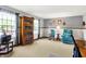 Bright living room featuring light grey walls, carpet, and windows at 7670 Lippincott Way, Indianapolis, IN 46268