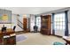 Bright living room with carpet, light grey walls and natural light at 7670 Lippincott Way, Indianapolis, IN 46268