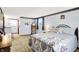 Comfortable main bedroom with carpet, a king bed, and large windows at 7670 Lippincott Way, Indianapolis, IN 46268