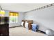 Versatile spare room with ample natural light and neutral carpeting is ideal for customization as an office or guest room at 7670 Lippincott Way, Indianapolis, IN 46268