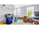 Spacious spare room with natural light, perfect for storage or customization, features neutral carpet and bright windows at 7670 Lippincott Way, Indianapolis, IN 46268