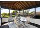 Enclosed sunroom with comfortable seating and views of the backyard offers a relaxing space for leisure and entertainment at 7670 Lippincott Way, Indianapolis, IN 46268