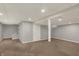 Finished basement featuring neutral walls and flooring, plus stairs at 781 Dayton Dr, Carmel, IN 46033