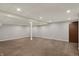 The finished basement offers recessed lighting and a support beam in the ceiling at 781 Dayton Dr, Carmel, IN 46033