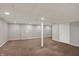 Finished basement with a support beam and updated lighting fixtures at 781 Dayton Dr, Carmel, IN 46033