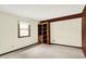 Bedroom featuring neutral carpet, ample light from a window, and a built-in bookshelf at 781 Dayton Dr, Carmel, IN 46033