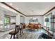 Bright dining room features wood trim, a stylish light fixture, and an area rug over wood floors at 781 Dayton Dr, Carmel, IN 46033