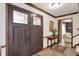 Inviting foyer with double doors, wood accents, and access to the living room at 781 Dayton Dr, Carmel, IN 46033