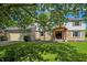 Charming two-story home with stone accents, mature trees, and a well-maintained lawn at 781 Dayton Dr, Carmel, IN 46033