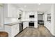 Modern kitchen with stainless steel appliances, white cabinets, granite counters, and wood flooring at 781 Dayton Dr, Carmel, IN 46033