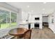 Modern kitchen with white cabinets, stainless appliances, stone counters and a bright, open feel at 781 Dayton Dr, Carmel, IN 46033