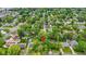 Aerial view of a residential neighborhood with tree-lined streets and well-maintained homes shows community charm at 7835 E 50Th St, Indianapolis, IN 46226