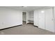 Finished basement with built-in desk and shelves, and neutral carpeting at 7835 E 50Th St, Indianapolis, IN 46226