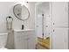 Chic bathroom showcasing a modern vanity with updated fixtures and bright lighting at 7835 E 50Th St, Indianapolis, IN 46226