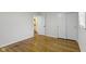 Bedroom features hardwood floors, closet, and a doorway to the bathroom at 7835 E 50Th St, Indianapolis, IN 46226