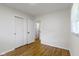 Cozy bedroom showcasing ample closet space and hardwood floors at 7835 E 50Th St, Indianapolis, IN 46226