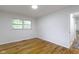 Bright bedroom with hardwood floors and a window, providing natural light and a view at 7835 E 50Th St, Indianapolis, IN 46226