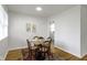 Charming dining area with hardwood floors, neutral decor, and abundant natural light, ideal for Gathering gatherings at 7835 E 50Th St, Indianapolis, IN 46226