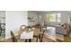 Open-concept living and dining area with hardwood floors, neutral decor, and plenty of natural light at 7835 E 50Th St, Indianapolis, IN 46226