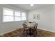 Cozy dining area featuring hardwood floors, neutral walls, and natural light, perfect for intimate meals at 7835 E 50Th St, Indianapolis, IN 46226
