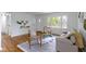 Well-lit living room with hardwood floors and neutral decor, creating a warm and welcoming space at 7835 E 50Th St, Indianapolis, IN 46226