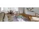 Spacious living room seamlessly connected to the dining area, featuring hardwood floors and neutral decor at 7835 E 50Th St, Indianapolis, IN 46226
