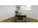 Bright office space with hardwood floors, a modern desk, and a comfortable chair at 7835 E 50Th St, Indianapolis, IN 46226