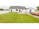 Lush green backyard with home, patio area, and in-ground swimming pool at 7895 E 175 N, Franklin, IN 46131